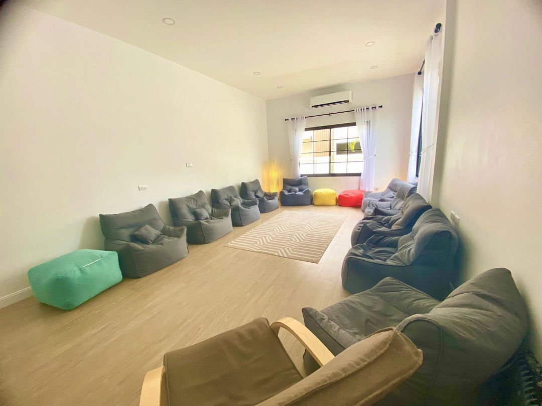 Bright methamphetamine addiction counseling room with comfy chairs