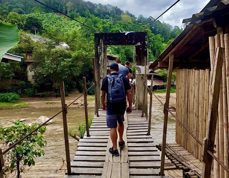 Trekking over the Ping river bridge in Chiang Mai