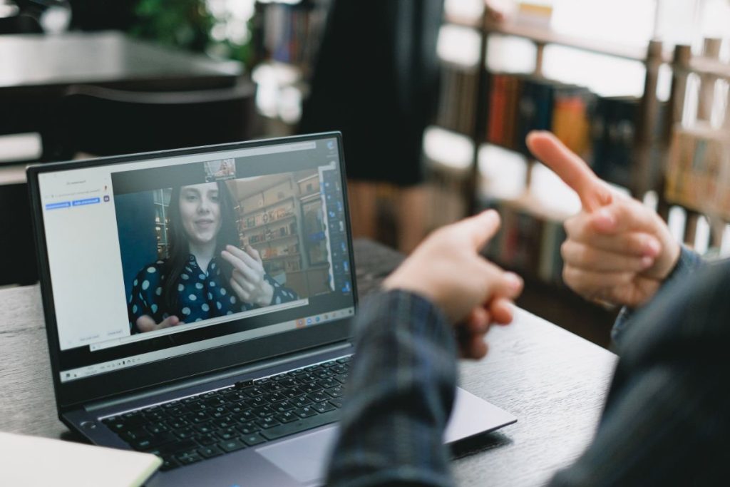 Woman in London talks with counselor in Thailand online