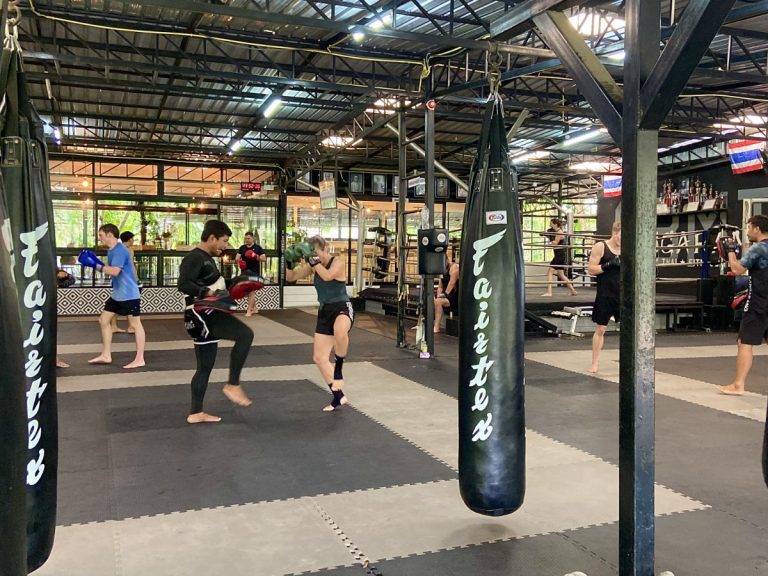 Strength training and pad work at main fitness center