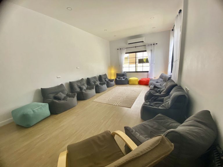 Soft chairs and bean bags inside group counseling room