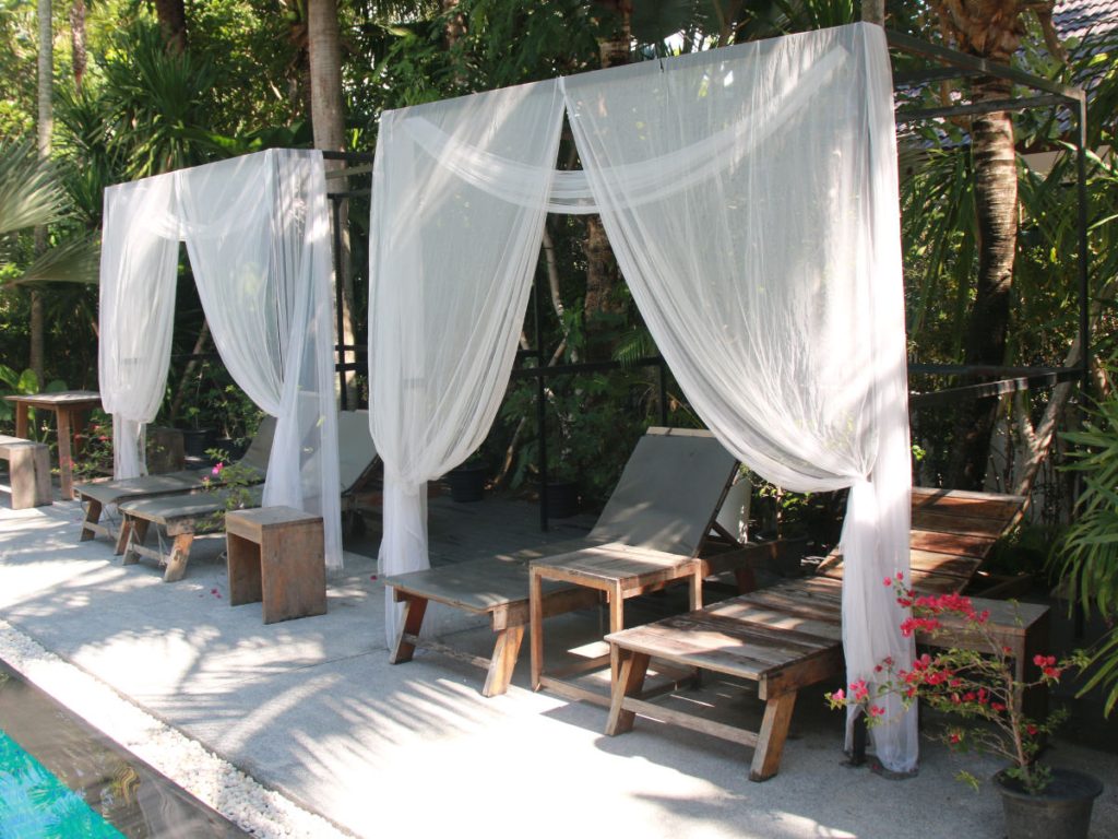 Poolside sunbeds at the One Step Rehab residence