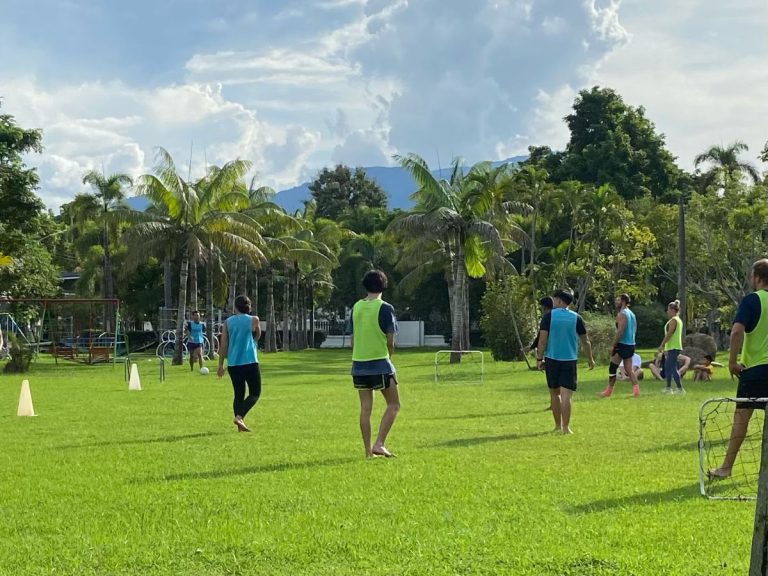 Mixed group play football with mini goals