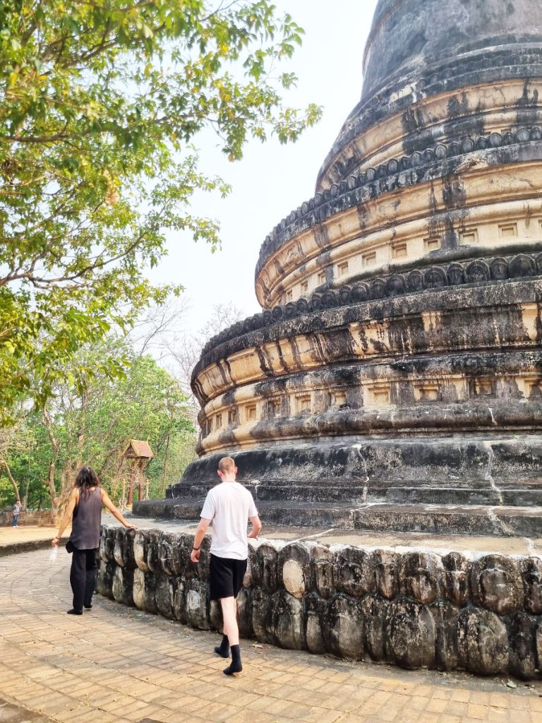 Walking around the large stone pagoda at Wat Umong