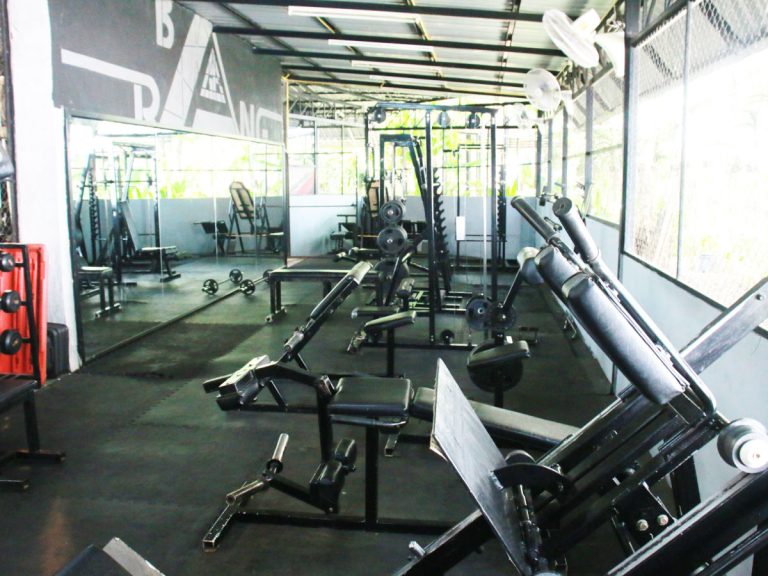 Weights benches and equipment at One Step's fitness center