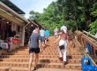Rehab residents walk up the steps to Wat Doi Suthep in Chaing mai