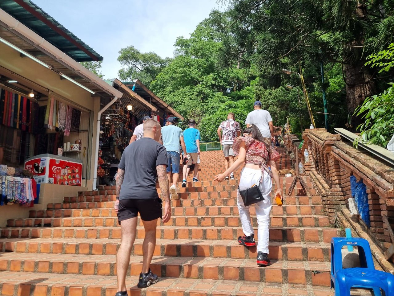 Rehab residents walk up the steps to Wat Doi Suthep in Chaing mai