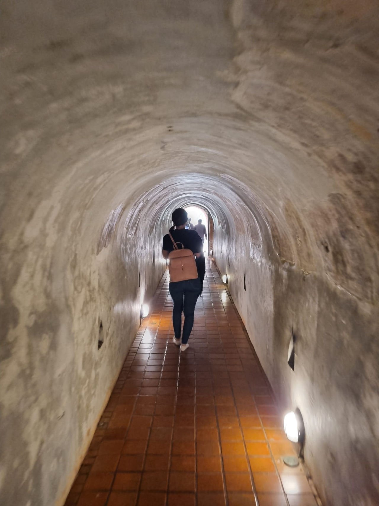 wat umong tunnels Woman walks through the tunnels of Wat Umong temple in Chiang Mai