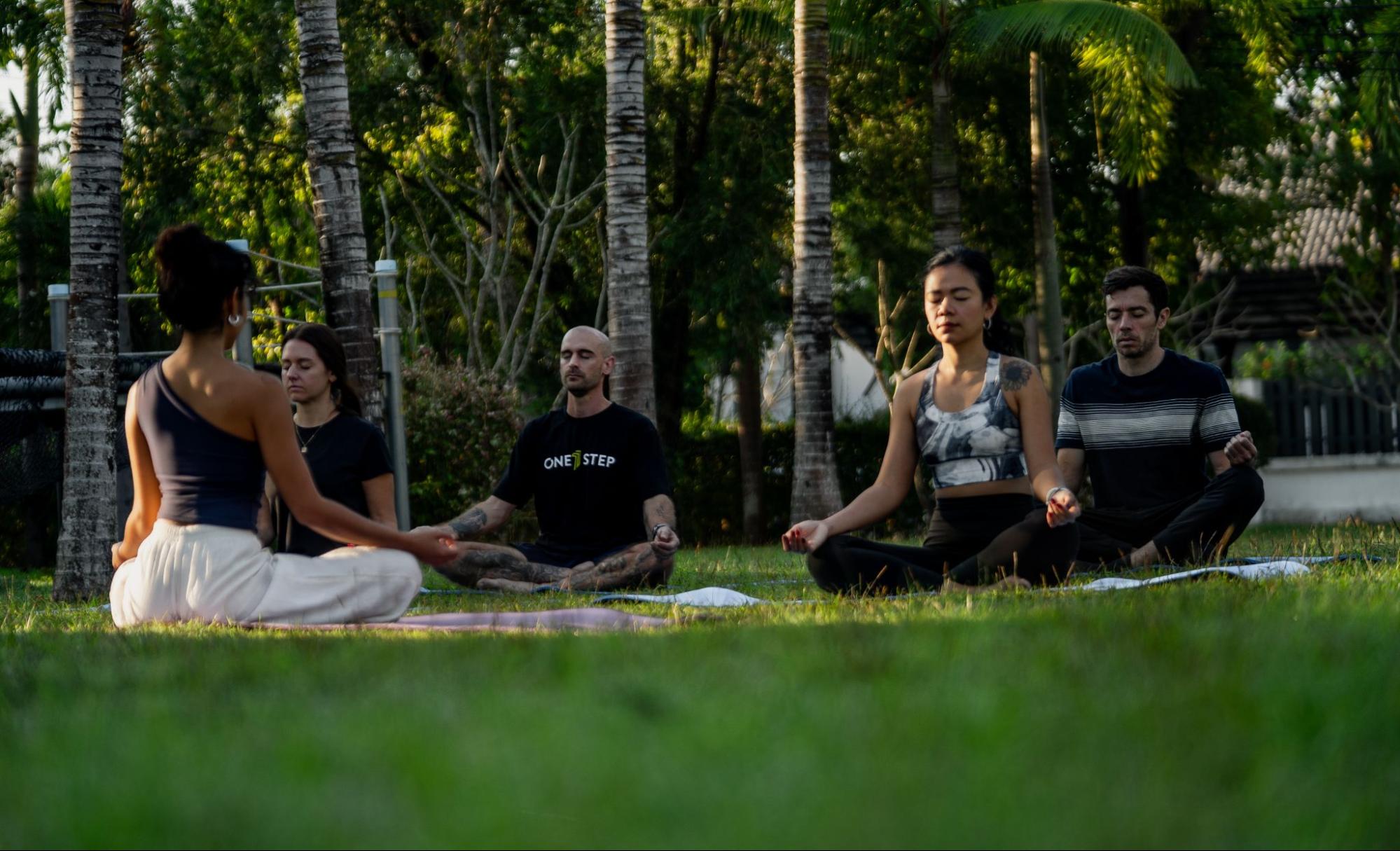 Group outdoor meditation session at One Step Rehab in Chiang Mai