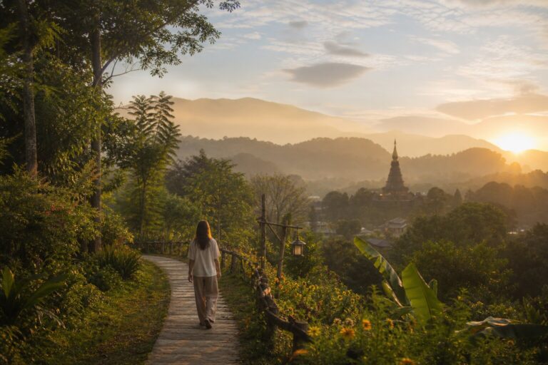 Peaceful path through Chiang Mai greenery toward temple at sunrise representing the recovery journey