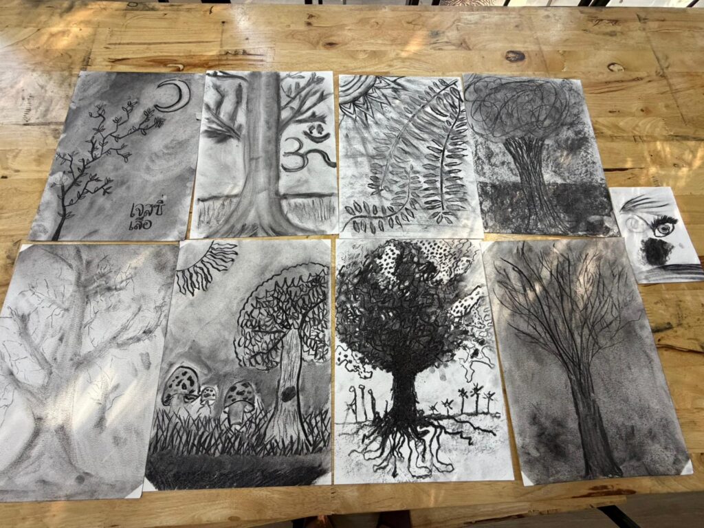 Charcoal tree drawings from an art therapy session