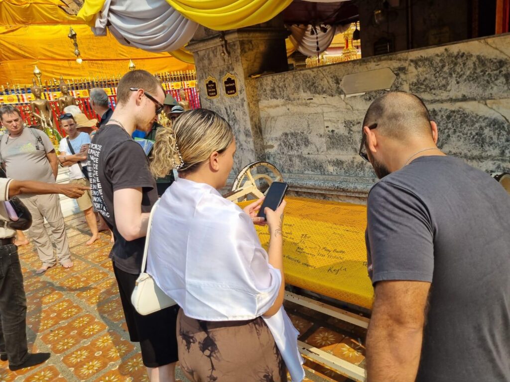 Clients exploring a temple ceremony in Chiang Mai