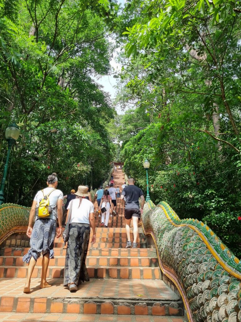 Climbing the Naga staircase at a Chiang Mai temple