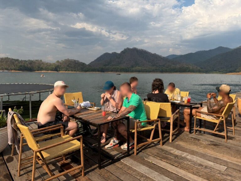 Clients enjoying a lakeside restaurant meal during a weekend excursion near Chiang Mai